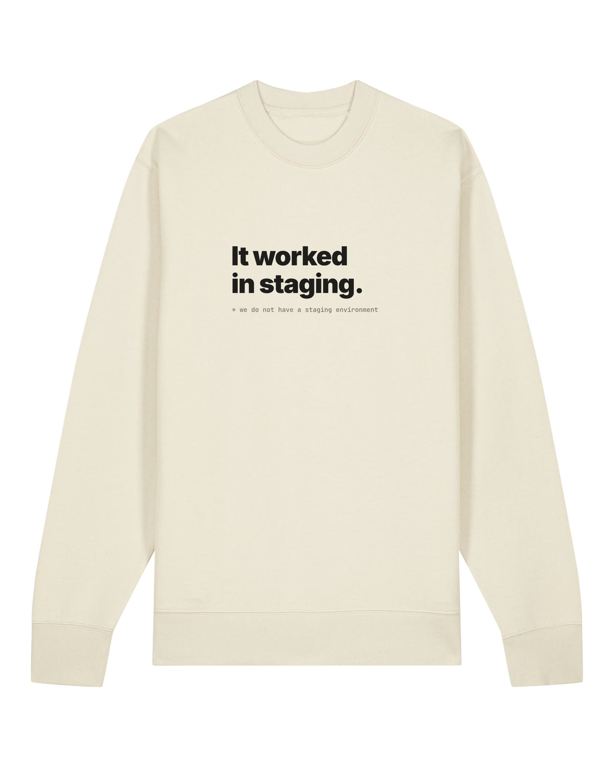 White crewneck sweatshirt with "It worked in staging." with a footnote about having no staging environment