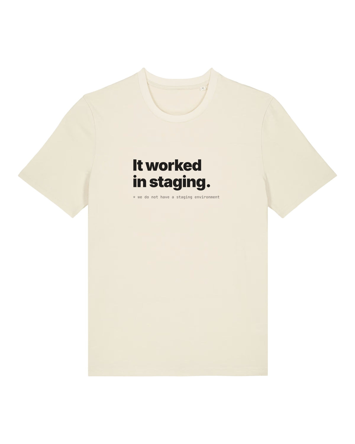 White t-shirt with "It worked in staging." with a footnote about having no staging environment
